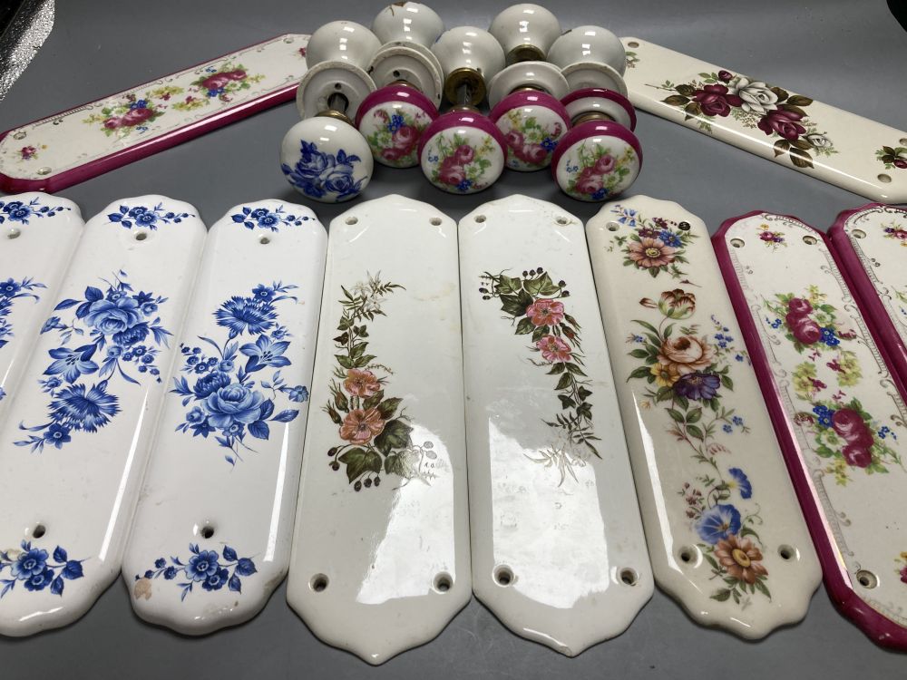 Five pairs of French porcelain door handles and ten porcelain door plates